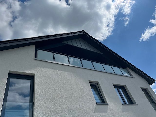 Referenzprojekt Dachbalkon mit Glasgeländer